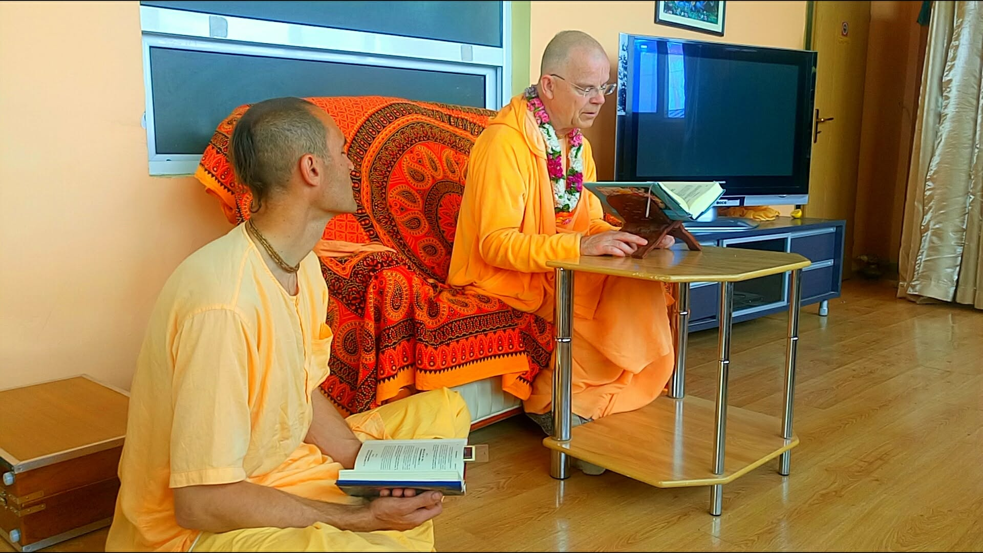 Śrīla Prabhupāda's disciple Bhakti Gauravani Maharaj reading Śrīmad-Bhāgavatam in the ashram