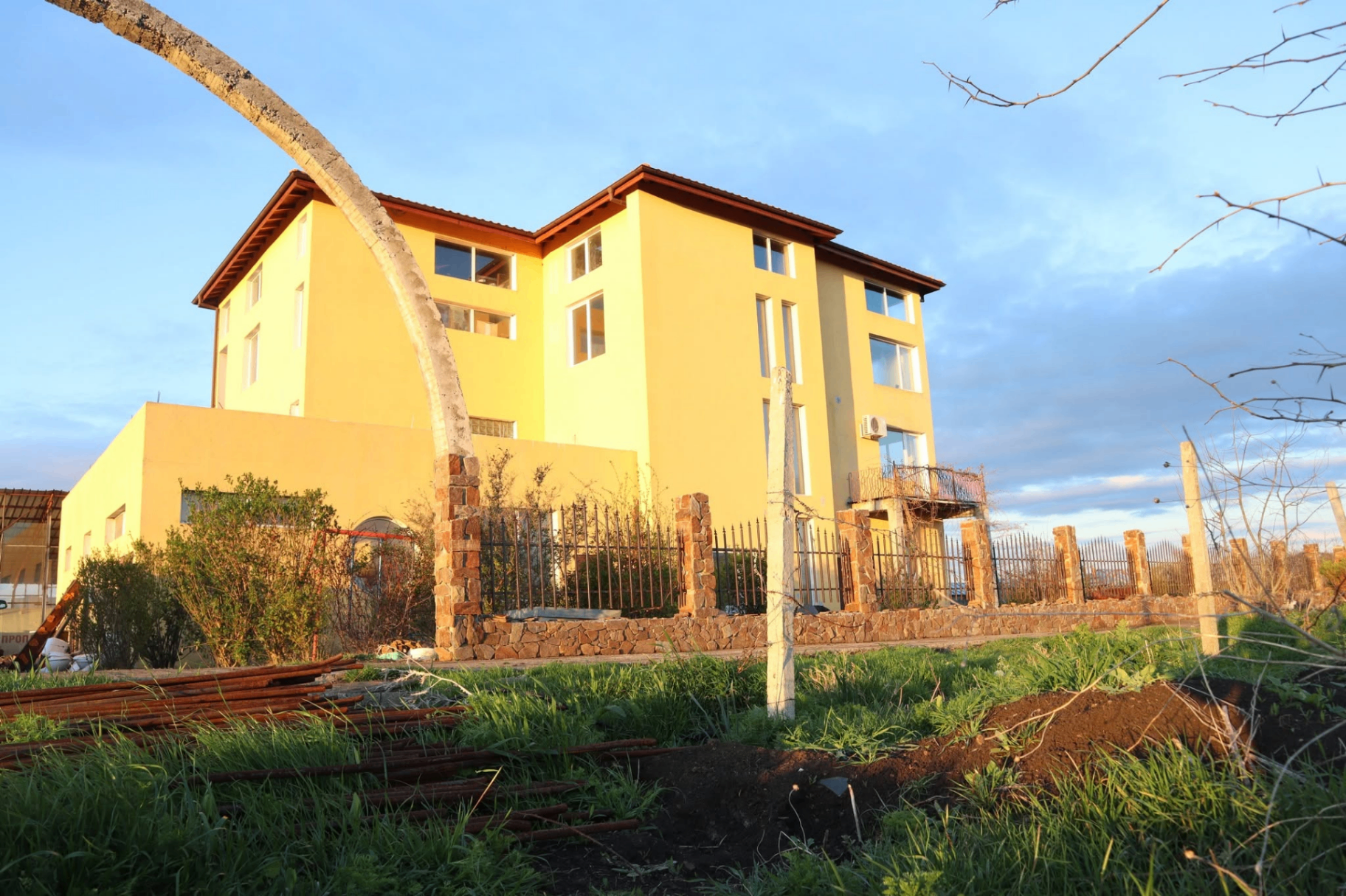 The farmhouse at golden hour — heart of daily community life