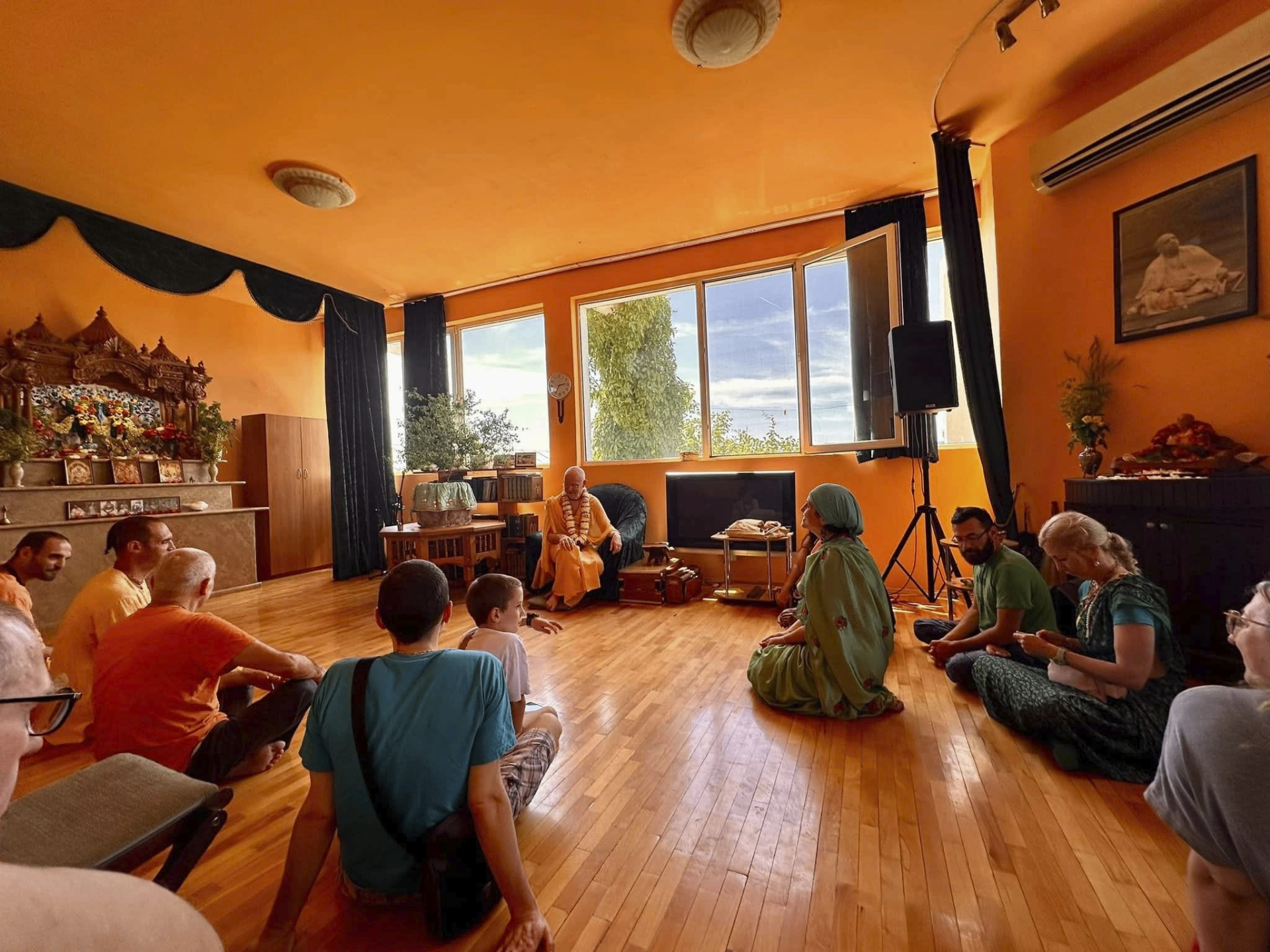 Class in the temple room — hearing from the Bhāgavatam