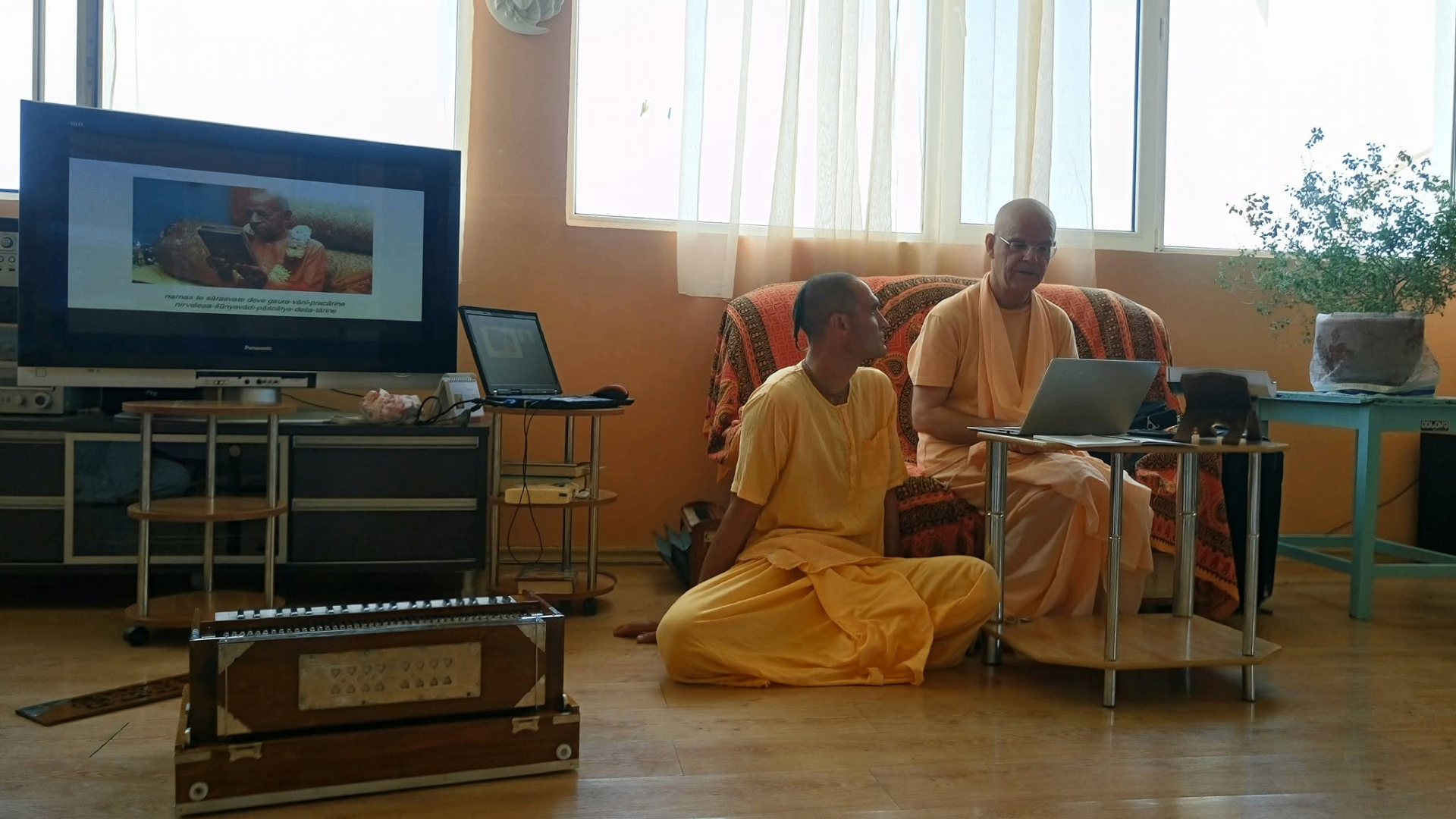 Kīrtan class — study and chanting together before the harmonium
