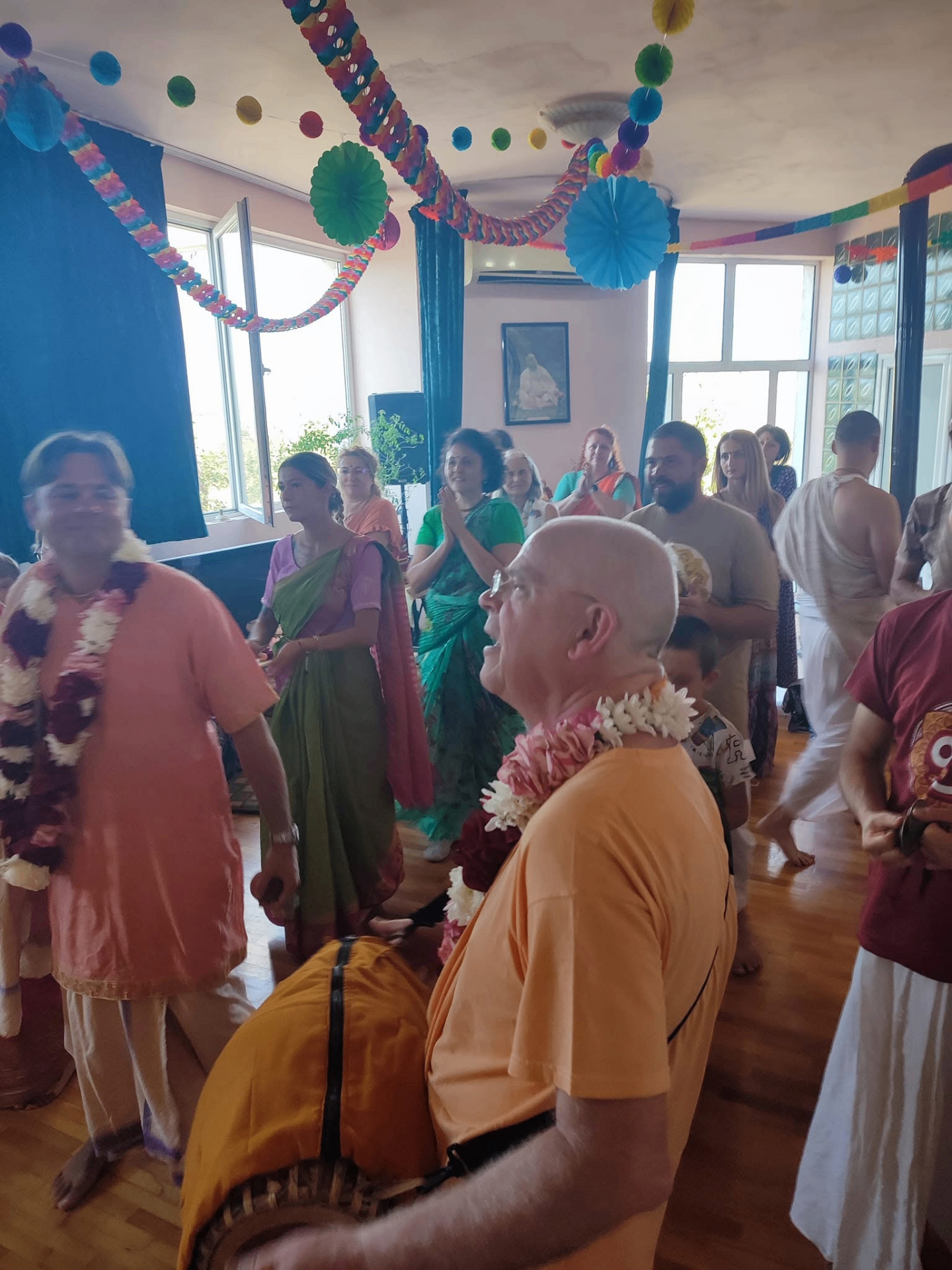 Kīrtan in the temple room — chanting the holy names together